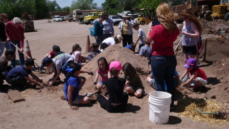 Close-up on the students in the dirt